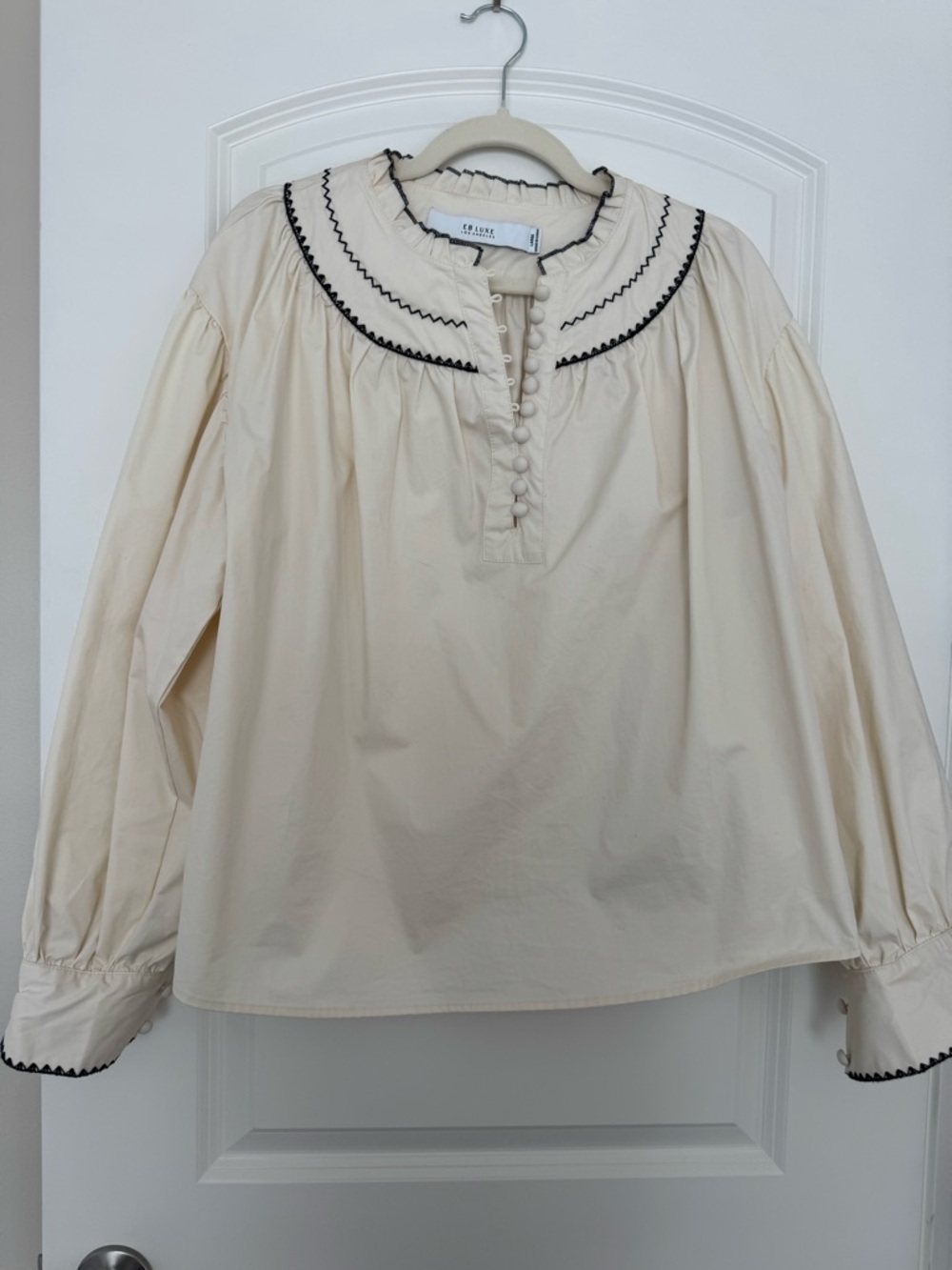 Luxe Cream Ruffled Collar Button-Front Blouse with Black Trim